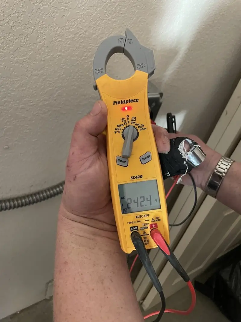 Voltage testing with clamp meter during Recessed Lighting Installation in Cockeysville
